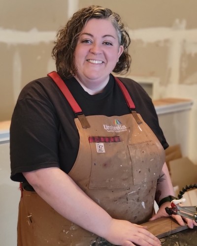 Beth Sahli in apron while woodworking