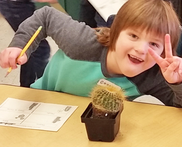 Student enjoying a Plantmobile experience at their school