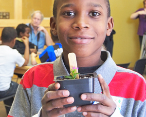 boy with school plant project