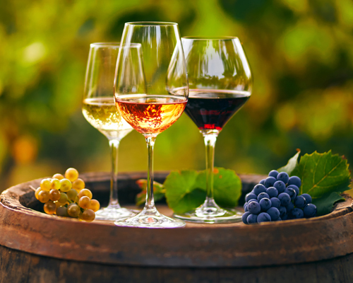 wine in glasses at harvest, photo by sedlacek/Shutterstock