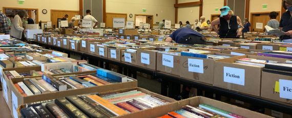 Books in boxes on tables at the book sale