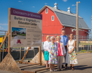 People gathered next to the Myers Education sign at the Farm