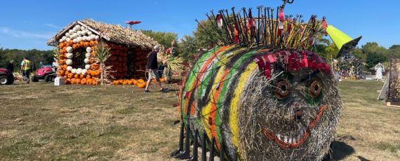 Pumpkin house and bug hay bale on scarecrow hill