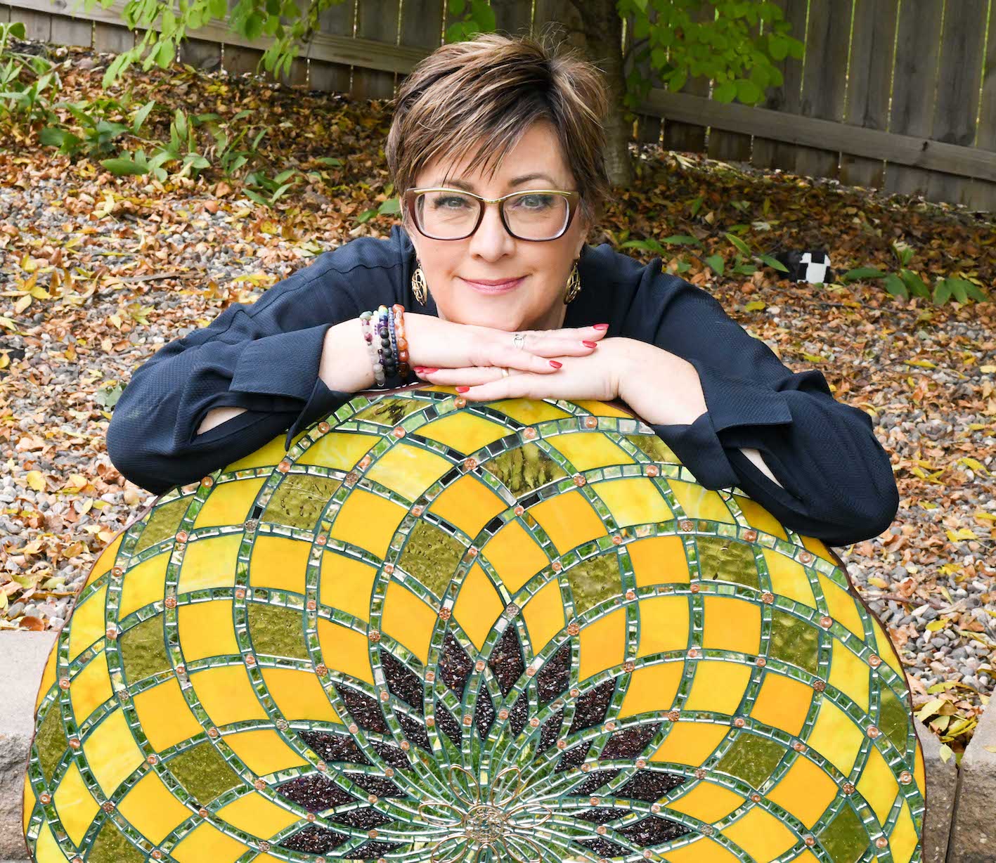 Headshot of shelley beaumont with her artwork