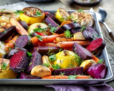 pan of brightly colored roasted vegetables