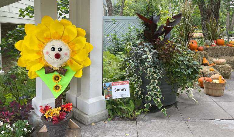 Sunflower scarecrow in the breezeway by Snyder building