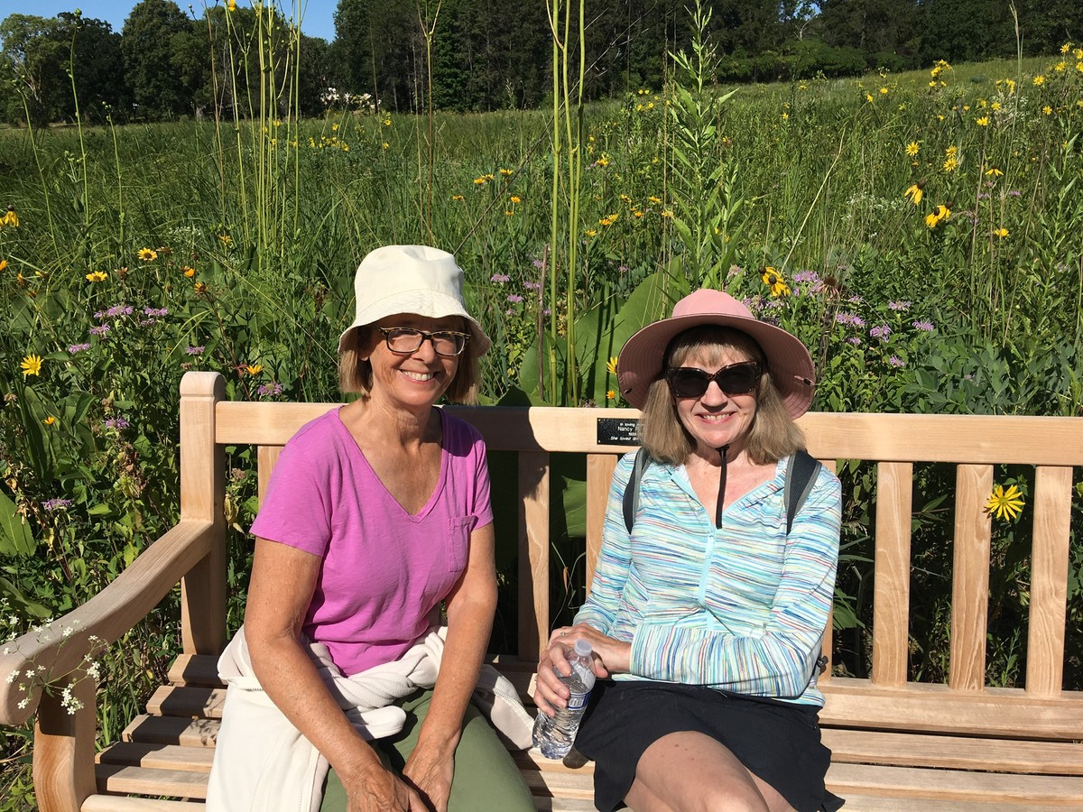 2 women sitting on a bench_members