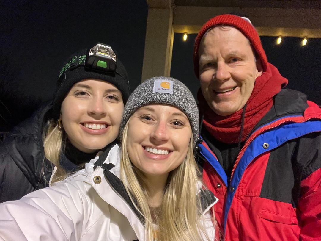 Dad and daughters at Winter Lights