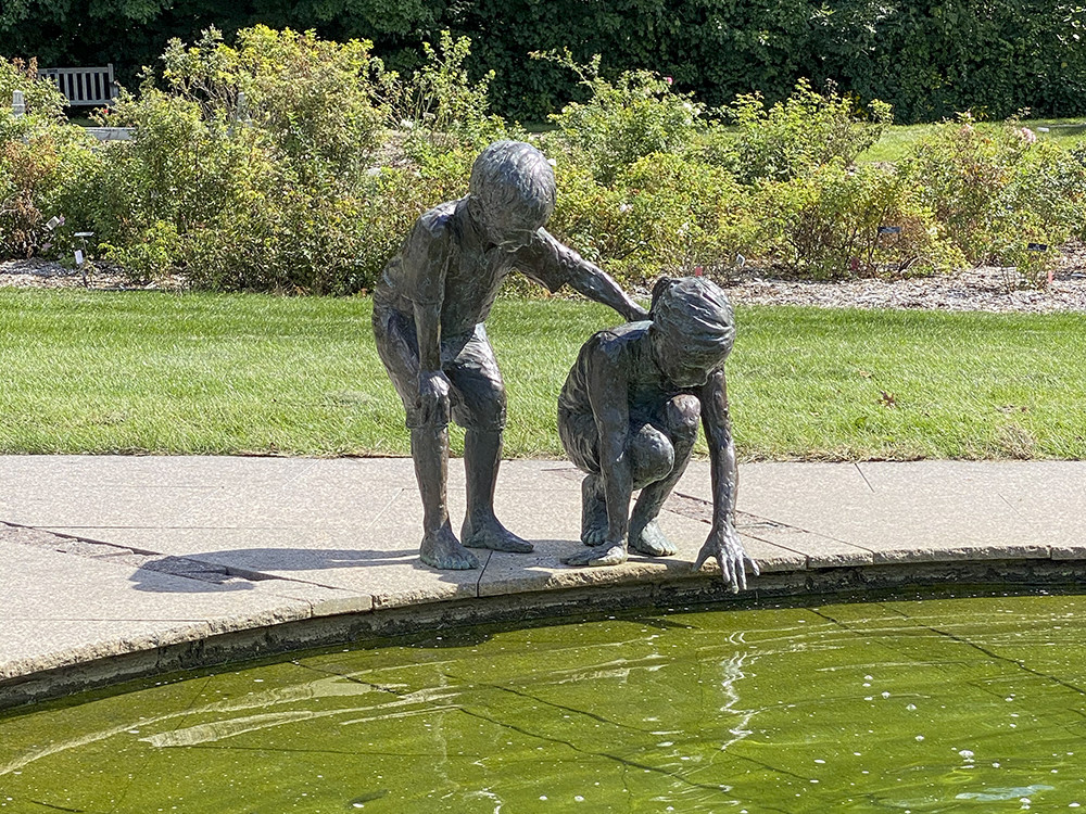 Wonderment sculpture of 2 children